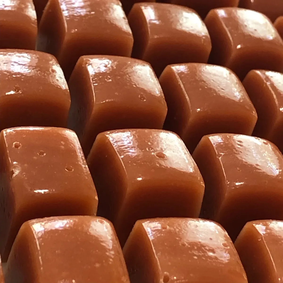 Freshly cut squares of golden caramel
